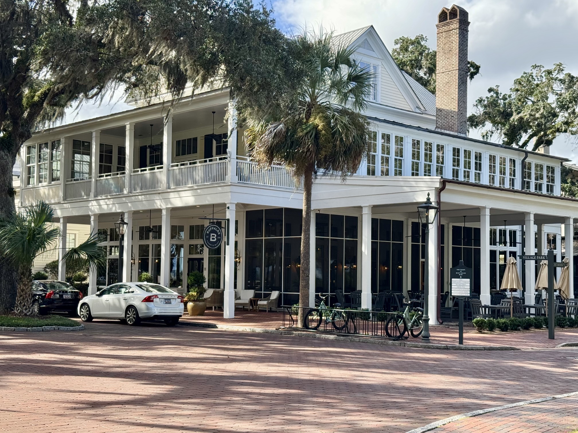exterior image of Buffalos restaurant in Palmetto Bluff SC, trees and brick streets