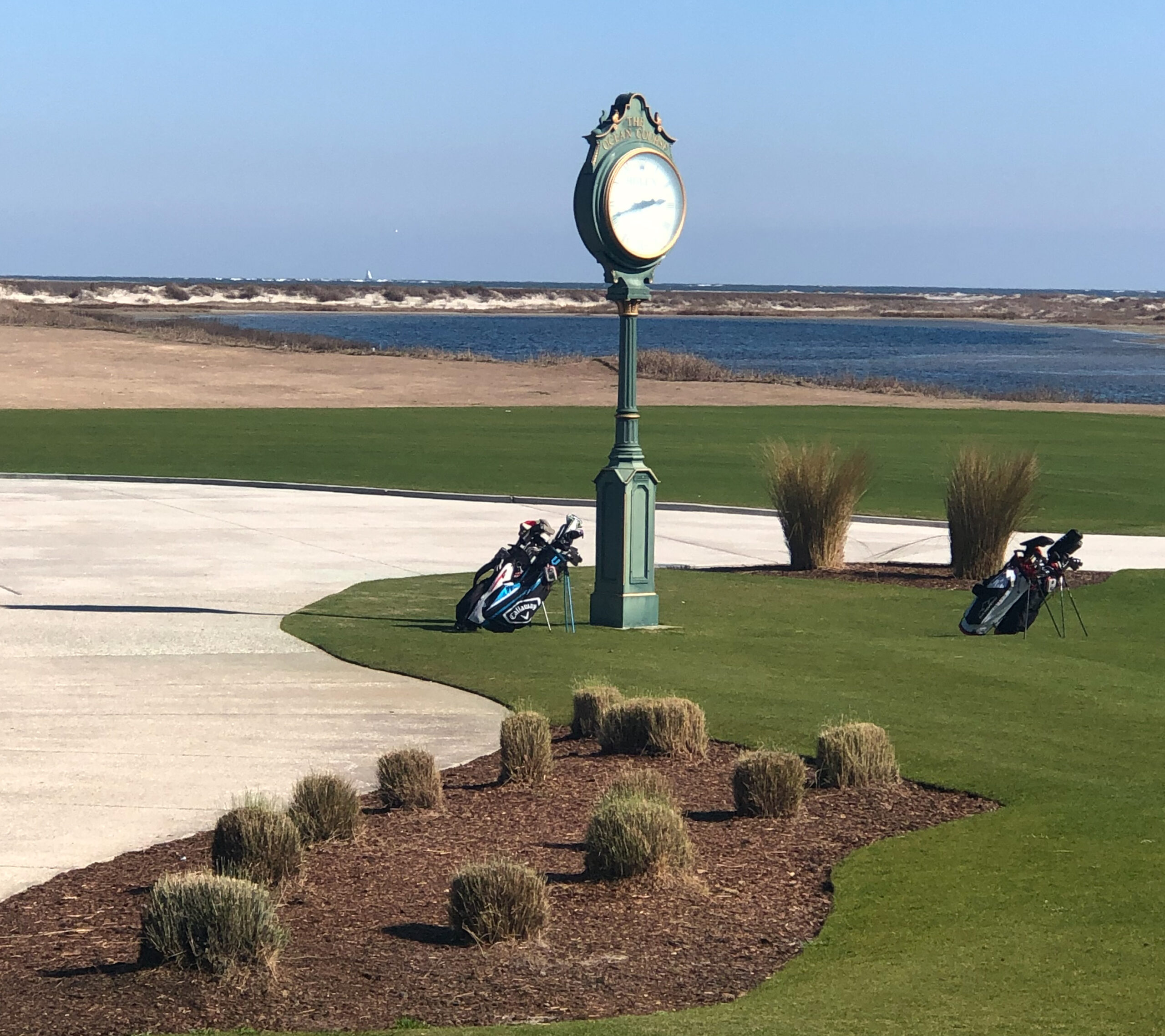 The clock tower at Ocean Course at Kiawah Island SC with ocean view in background